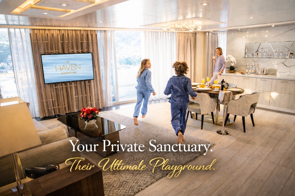 A spacious living and dining area in a Norwegian Cruise Line Haven Family Villa where two children are running toward a window and a woman is enjoying a drink by the bar.